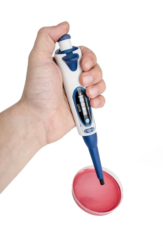 a close up of a person holding a device in their hand, pus - filled boils, rapidograph, official product photo, nurse