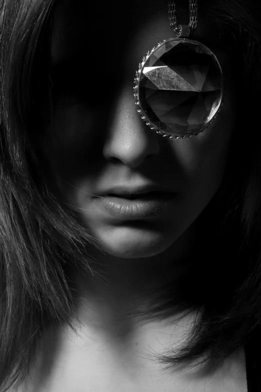 a woman with a pair of glasses on her face, a black and white photo, by Dimitre Manassiev Mehandjiysky, art photography, discreet lensflare, wearing an eyepatch, modern high sharpness photo, wearing a bejeweled mask