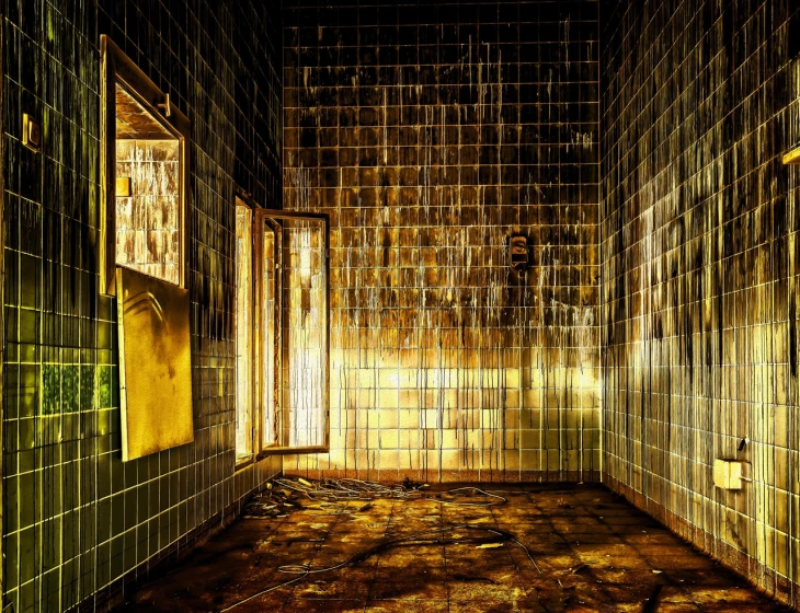 a bathroom with tiled walls and a tiled floor, by Alexander Bogen, shutterstock, conceptual art, kowloon walled city, dramatic golden light, post nuclear fallout, glass