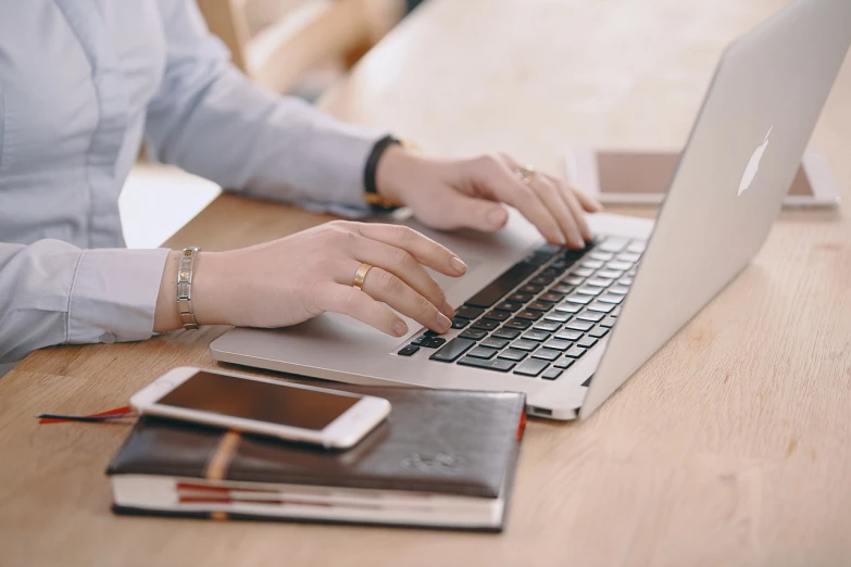 a close up of a person typing on a laptop, by Emma Andijewska, office background, background image, professional detailed photo, writing a letter