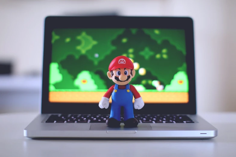 a close up of a toy on a laptop, inspired by Mario Comensoli, unsplash, hero pose, pc screen image, game resources, 2 d render