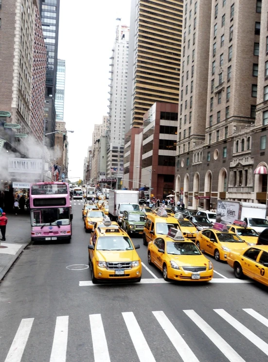 a street filled with lots of traffic next to tall buildings, happening, taxi, ny, pic, flash photo