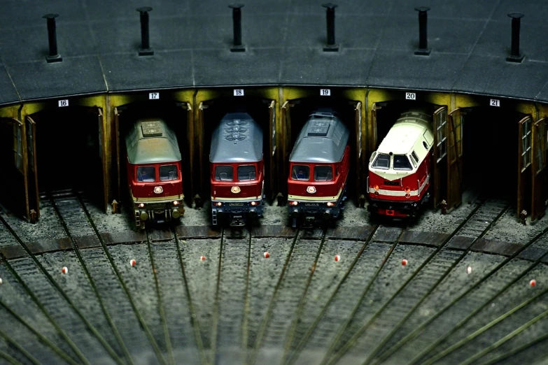 a couple of trains that are next to each other, by Werner Gutzeit, flickr, figuration libre, mini model, train in a tunnel, cars parked underneath, ultrafine detail ”