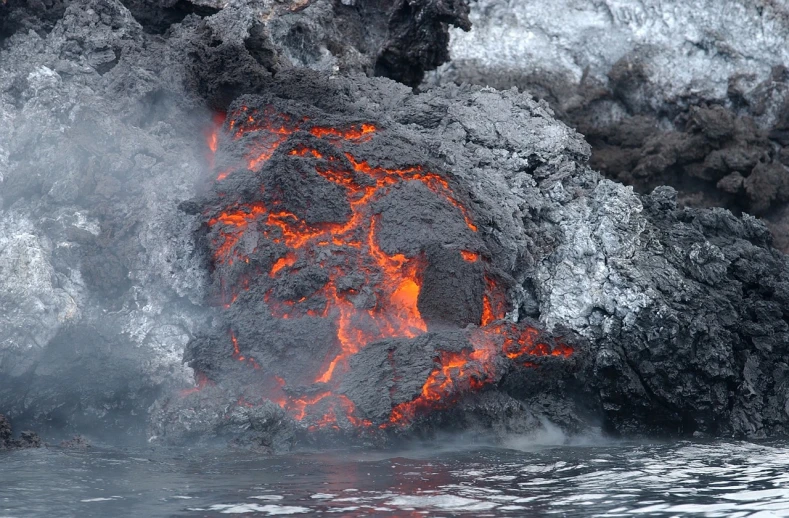 a large plume of lava rising out of a body of water, a photo, by Hermann Rüdisühli, flickr, igneous rock materials, pretty face!!, volcanic skeleton, very sweaty
