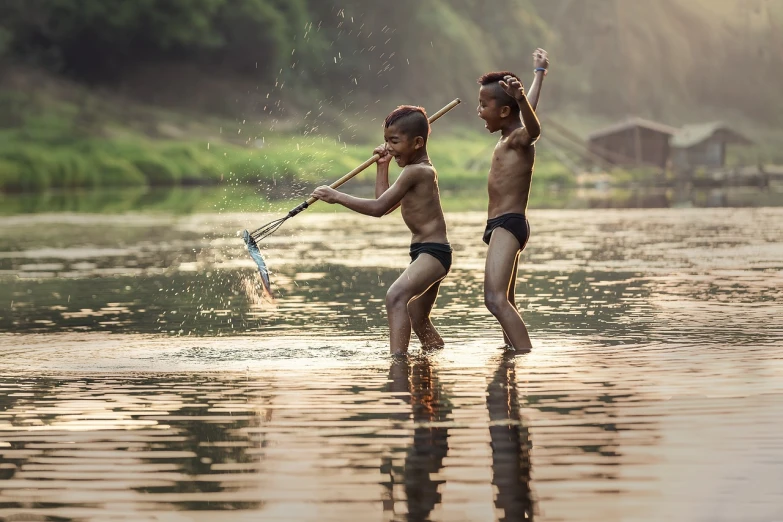 a couple of kids that are standing in the water, a picture, shutterstock, tribe members chasing, cinematic. by leng jun, fishing, playful pose