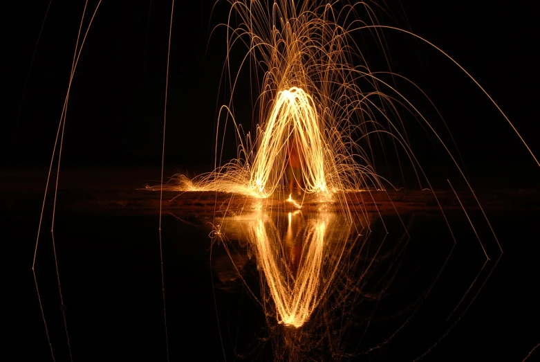 a long exposure photograph of a light painting, a picture, flickr, art photography, fire reflection, in triangular formation, istockphoto, light particules