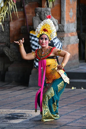 a woman that is standing in the street, a statue, inspired by I Ketut Soki, visual art, classic dancer striking a pose, in a temple, liana, square