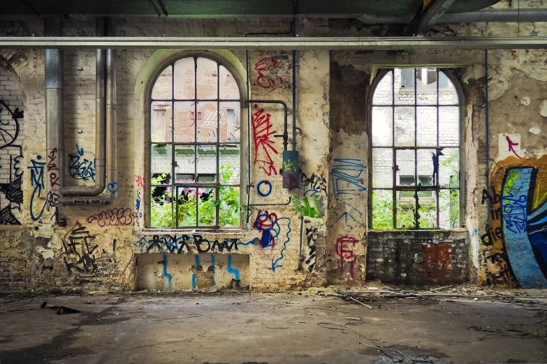 a room with graffiti on the walls and windows, flickr, graffiti, factories and nature, postprocessed, archs and walls, hannover