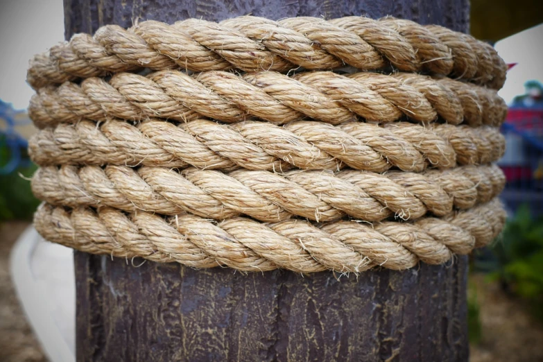 a close up of a rope wrapped around a pole, renaissance, wood texture on top, close-up product photo, high detail product photo, outdoor photo