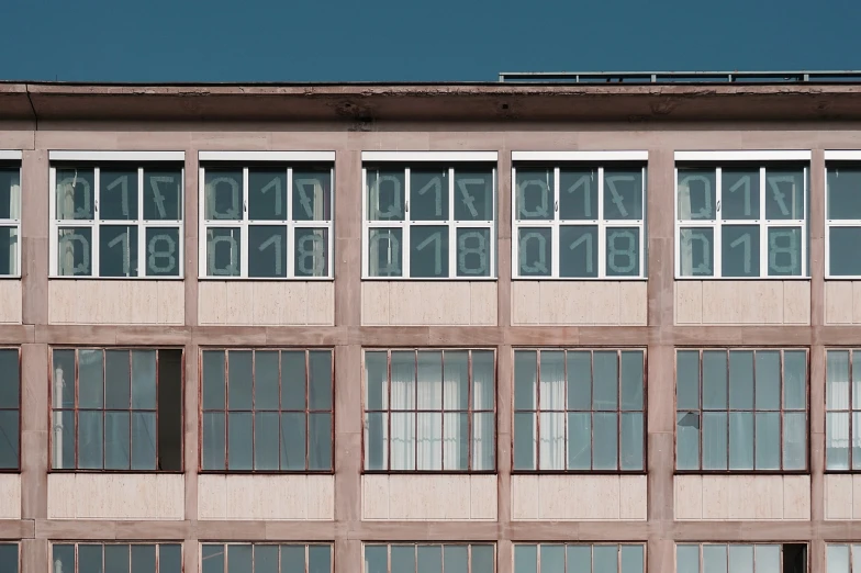 a red fire hydrant sitting in front of a tall building, by Andrei Kolkoutine, bauhaus, cyan shutters on windows, detailed factory, numerical, alessio albi