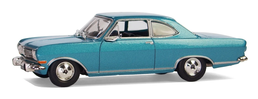 a blue toy car sitting on top of a white surface, a beautiful detailed orixa, c1970, dynamic pearlescent teal light, 1:87