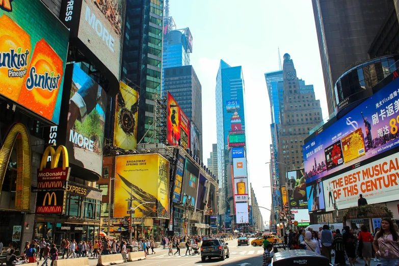 a busy city street filled with lots of billboards, a picture, by Douglas Shuler, beautiful sunny day, time square, epic buildings in the center, usa-sep 20