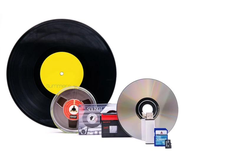 a couple of cds sitting next to each other, a picture, bauhaus, devices and instruments, on white background, barcodes, vcr tape