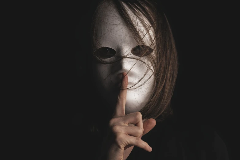 a person with a white mask covering their face, a stock photo, inspired by Nicola Samori, shutterstock, long nose, hand on her chin, sandman, top secret