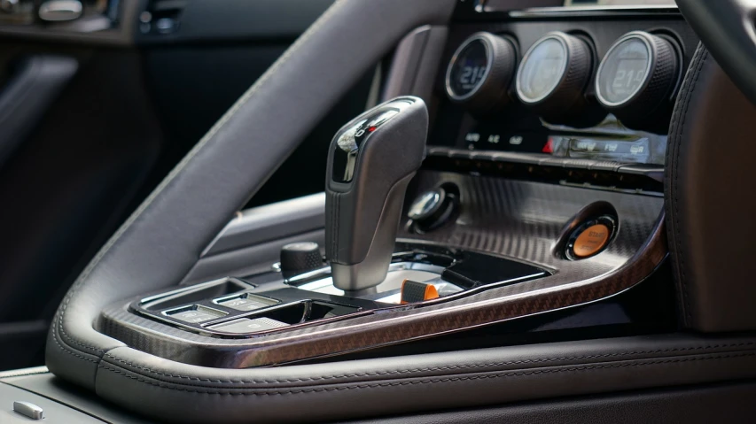 a close up of the center console of a car, by Randy Post, les automatistes, chrome and carbon, professionally color graded, mercedes, dynamic and dominant