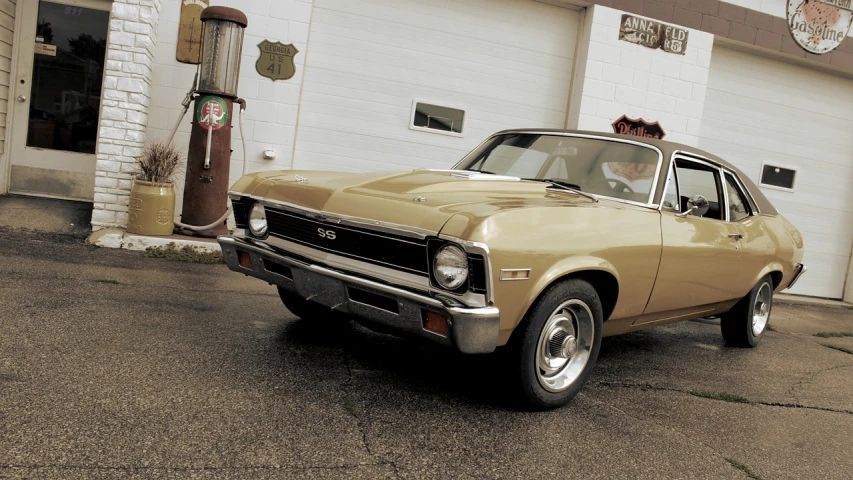 a car parked in front of a gas station, a pastel, by Darrell Riche, flickr, shiny gold, stained antique copper car paint, cinematic front shot, gm