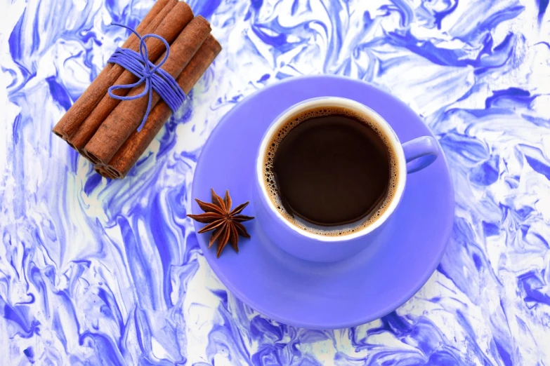 a cup of coffee sitting on top of a purple saucer, inspired by Aleksandr Gerasimov, cinnamon, cold blue colors, amazing background, marbled