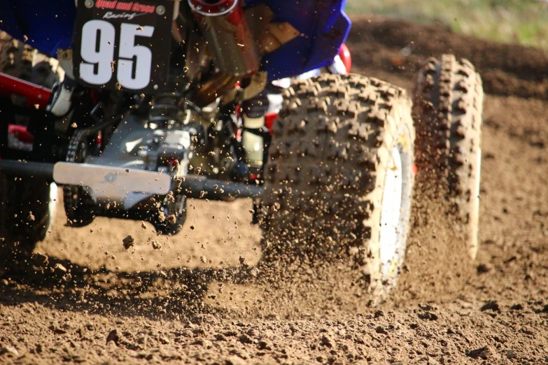 a person riding a dirt bike on a dirt track, a picture, flickr, micro detail 4k, buggy, wallpaper - 1 0 2 4, sand particles