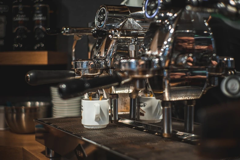 a close up of a coffee machine on a table, process art, high res photo, museum quality photo, in a coffee shop, professional product photo