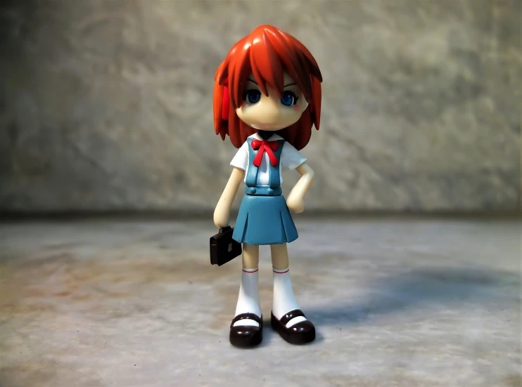 a close up of a figurine of a girl with red hair, a tilt shift photo, inspired by Un'ichi Hiratsuka, shin hanga, cute!! chibi!!! schoolgirl, full body wide shot, made in maya and photoshop, girl wearing uniform