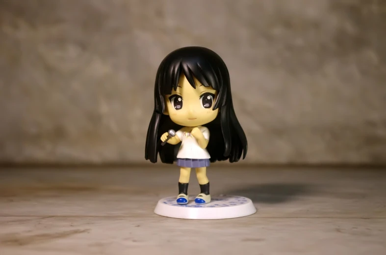 a close up of a small figurine of a girl, a picture, by Jin Homura, full body wide shot, student, with straight black hair, kid