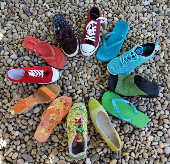 several pairs of colorful shoes arranged in a circle, jade, group photo, various styles, rainbow colours