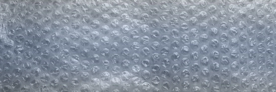 a shower head with a lot of water coming out of it, an album cover, inspired by Hermann Rüdisühli, pexels, plasticien, 8k fabric texture details, many floating spheres, plastic wrap, gray