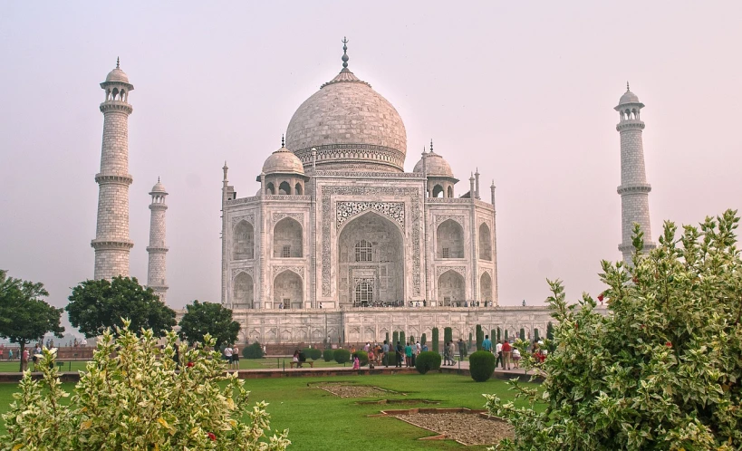 a group of people standing in front of a building, a picture, flickr, taj mahal, in a gentle green dawn light, highly detailed hdr, pink marble building