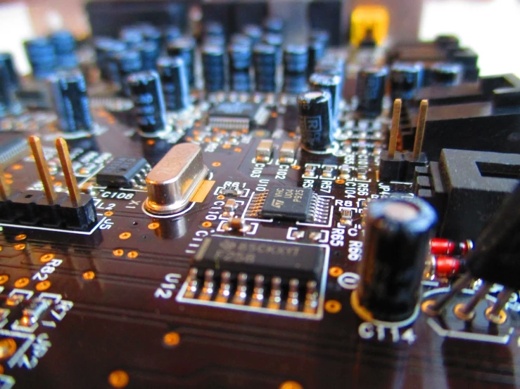 a close up of a computer mother board, by Dan Christensen, devices and instruments, capacitors, accurately portrayed, audio equipments