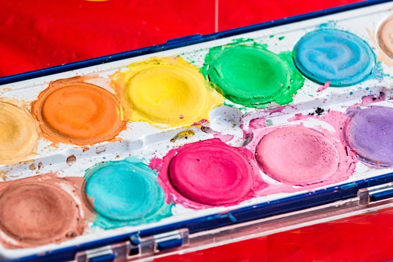 a close up of a box of watercolor paints, inspired by Albert Irvin, pexels, face painting, colourful background, full of colour 8-w 1024, ((water color))