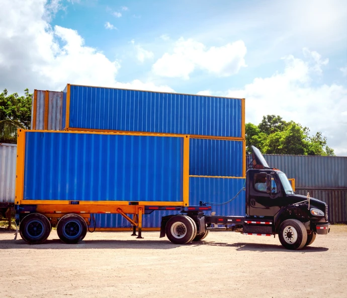 a truck with a container on the back of it, by david rubín, blue and yellow, corporate photo, brazilian, modular
