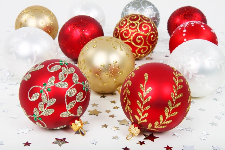 a group of christmas ornaments sitting on top of a table, by Juan O'Gorman, red white and gold color scheme, high quality product image”