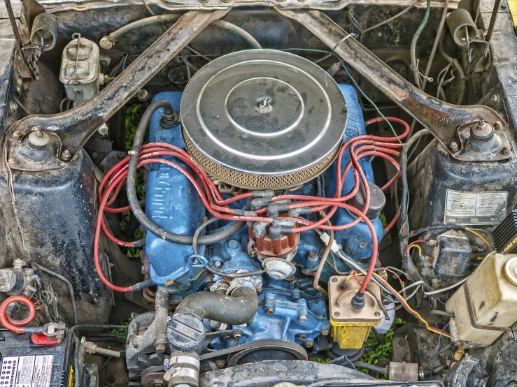 a close up of the engine of a car, by Arnie Swekel, renaissance, detailed medium format photo, highly detailed and colored, an abandoned, top view