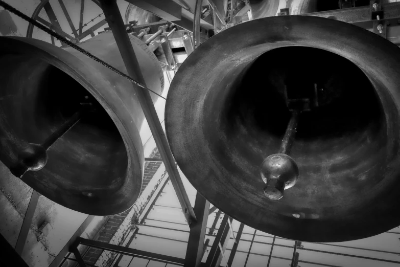 a couple of bells sitting next to each other, inspired by Alfred Eisenstaedt, precisionism, horns!, hadron collider, monochrome hdr, aaaaaaaaaaaaaaaaaaaaaa
