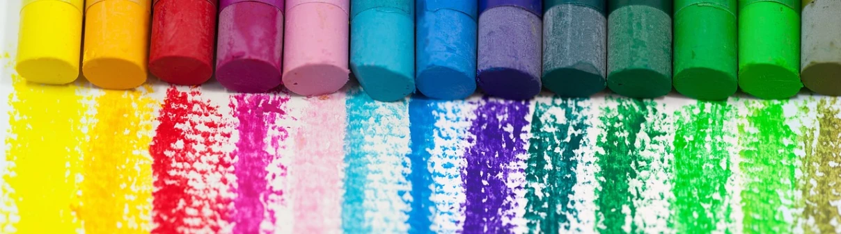 a group of crayons sitting on top of a table, chalk art, trending on pixabay, crayon art, purple and blue colour palette, pink and teal color palette, chalk texture on canvas, colourful close up shot