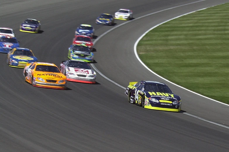 a group of cars racing on a race track, by Ken Elias, flickr, photorealism, on flickr in 2 0 0 3, idaho, nascar race, tv footage