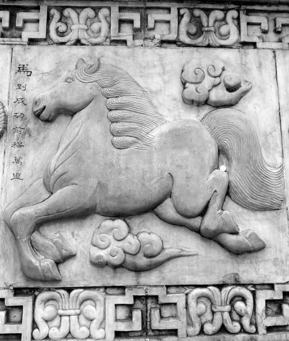 a black and white photo of a horse on a wall, a marble sculpture, inspired by Li Cheng, featured on pixabay, concrete art, chinese text, flat shaped stone relief, detailed carved ornaments, traditional chinese textures