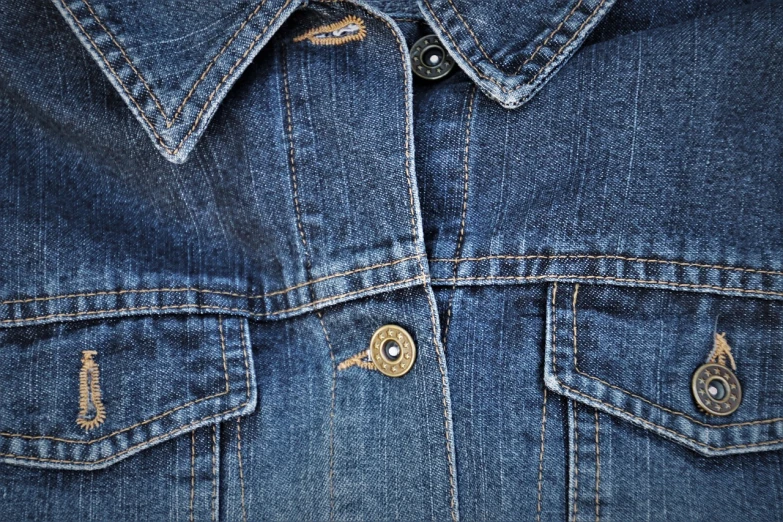 a close up of a denim jacket on a mannequin mannequin mannequin mannequin mannequin mannequin mann, by Antonín Chittussi, high resolution details, high details photo, seams stitched tightly, photorealistic hyperdetail