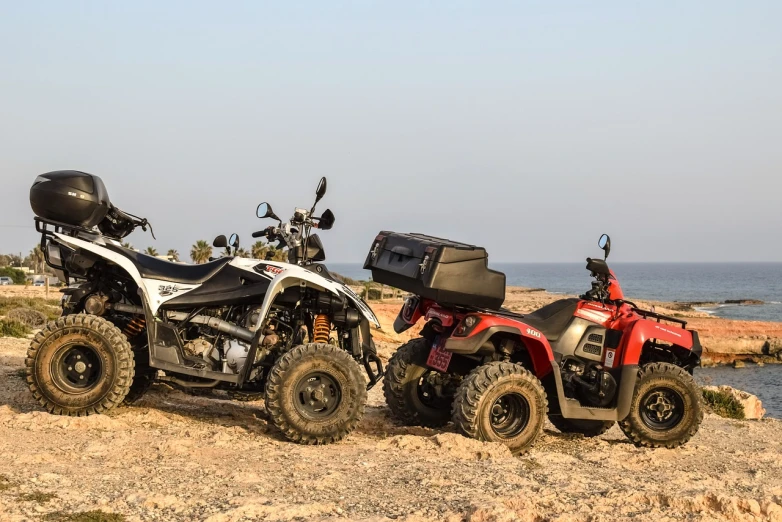 two atvs parked next to each other on a beach, a picture, by Romain brook, shutterstock, dau-al-set, portable generator, moroccan, studio shot, close - up photo