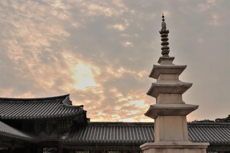 a tall tower sitting in the middle of a courtyard, a picture, inspired by Kim Hong-do, unsplash, among heavenly sunlit clouds, morning detail, traditional, unedited