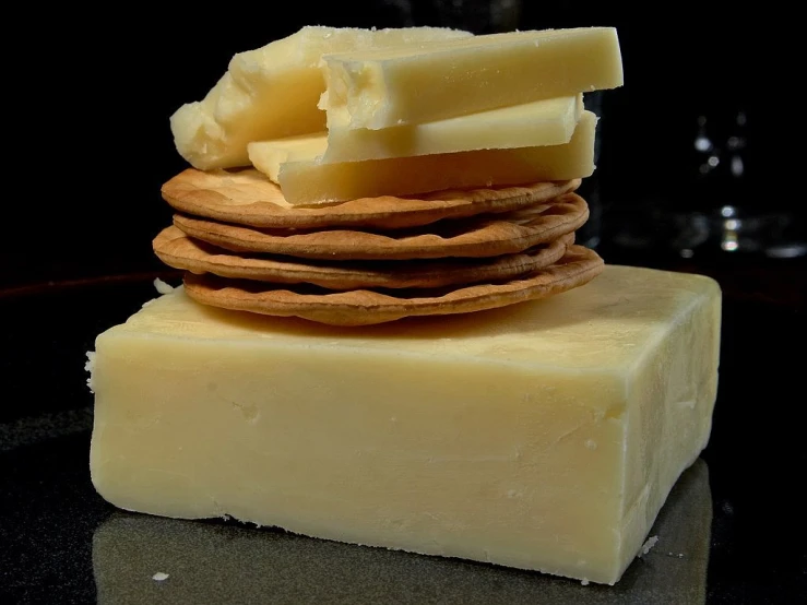 a stack of crackers and cheese stacked on top of each other, a portrait, by Adam Chmielowski, flickr, dau-al-set, scottish, !!natural beauty!!, ivory, the photo shows a large