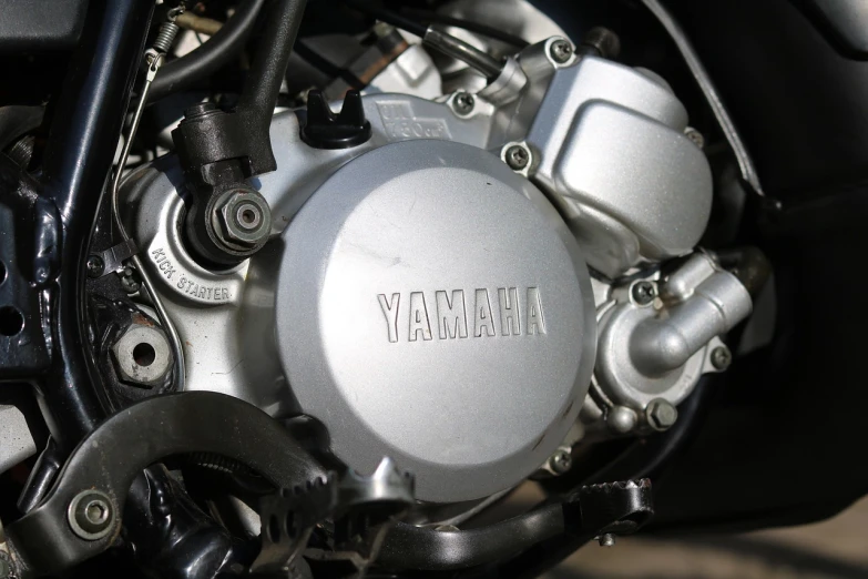 a close up of the engine of a motorcycle, by Kiyoshi Yamashita, unsplash, vanitas, motocross bike, [ 4 k photorealism ], portrait of jerma985, bottom - view