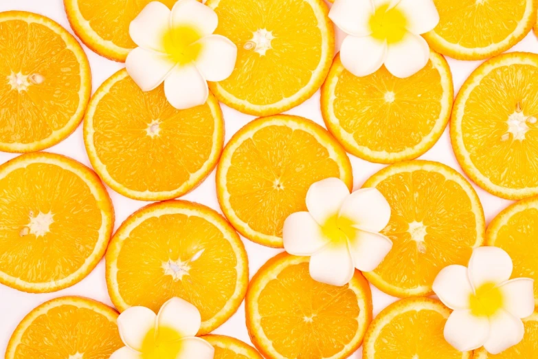 a bunch of orange slices with flowers on them, a stock photo, by Tadashi Nakayama, shutterstock contest winner, minimalism, plumeria, background is white, patterned background, high angle close up shot