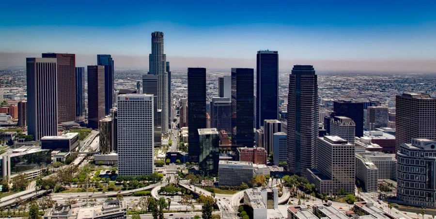 a view of a city with lots of tall buildings, a stock photo, inspired by L. A. Ring, iso 1 0 0 wide view, los angelos, hd aerial photography, on a bright day