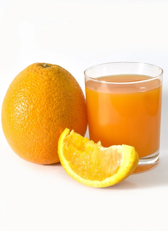 a glass of orange juice next to an orange, istockphoto, fruitcore, on a white background, hairy orange body