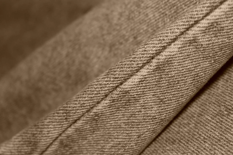 a close up of a piece of cloth, a macro photograph, unsplash, sepia tones, 8k detail post-processing, brown pants, 8 k detail post - processing