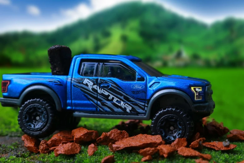 a toy truck sitting on top of a pile of rocks, a picture, by John Luke, unsplash, photorealism, ford f-150 raptor, 🦩🪐🐞👩🏻🦳, blue realistic 3 d render, vertical wallpaper