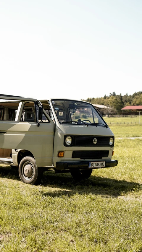 a van that is sitting in the grass, a picture, by Justus van Gent, unsplash, anato finnstark. front view, 1985 cheverlot k20 c10, arrendajo in avila pinewood, goat