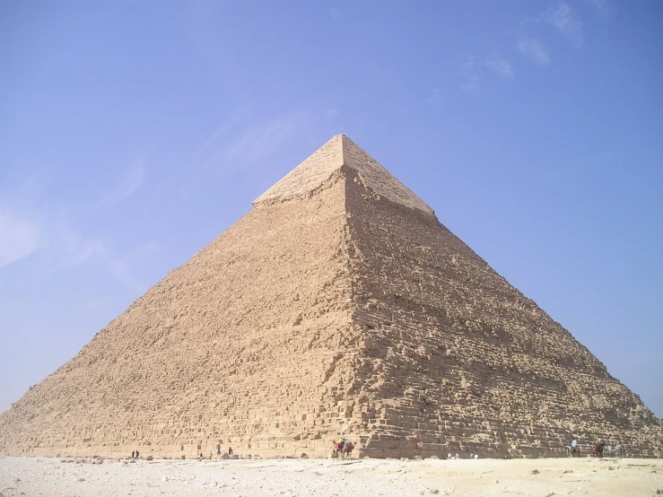 a group of people standing in front of a pyramid, wikimedia, beautiful angle, a large, tomb