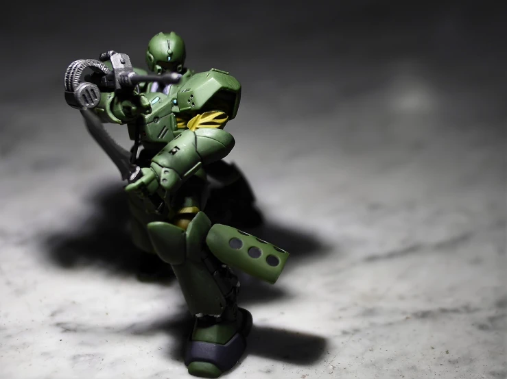 a close up of a toy on a table, a macro photograph, inspired by Ryūsei Kishida, shin hanga, space marine, full body! shot, green head, mgs